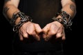 Criminals hands in handcuffs, a symbol of arrest, law violation