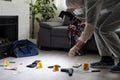 Criminological expert collecting evidence at the crime scene. Royalty Free Stock Photo