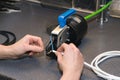 Crimping of bushings at the ends of an electric cable