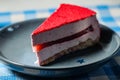 Crimson Holiday Cheesecake on dark plate Royalty Free Stock Photo