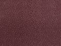 Crimson leather surface as a background, skin texture. Skin text