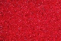 Crimson-red glass beads background - closeup beads texture