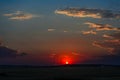 Crimson red sunset over the hill with a black silhouette of an a Royalty Free Stock Photo