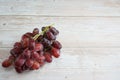 Crimson seedless grape with good levels of sweetness and an attractive appearance on top of wooden table