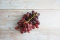 Crimson seedless grape with good levels of sweetness and an attractive appearance on top of wooden table