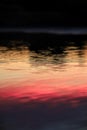 Crimson skies mirrored in tranquil waters