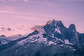 Crimson Sunrise over Mont-Blanc Snowy Peaks and Glaciers with Clouds