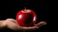 Crimson Temptation: A Hand Holding a Red Apple