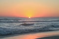 Crimson Tropical Sunset over Pacific Ocean Waves