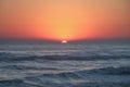 Crimson Tropical Sunset over Pacific Ocean Waves