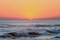 Crimson Tropical Sunset over Pacific Ocean Waves