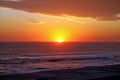 Crimson Tropical Sunset over Pacific Ocean Waves