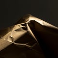 Crinkled brown paper is lit dramatically, creating shadows and highlights that Royalty Free Stock Photo