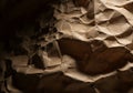 Crinkled paper texture with dramatic lighting and shadows Royalty Free Stock Photo