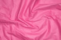 Crinkled pink material texture or background