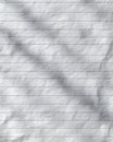 Crinkled White Sheet of Paper with Horizontal Lines and Shadows Creating Depth and Texture for Creative Uses and Writing Royalty Free Stock Photo