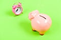 Crisi time. retirement. family budget. success in finance and commerce. piggy bank with alarm clock. Moneybox. business Royalty Free Stock Photo