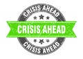 crisis ahead round stamp with ribbon. label sign Royalty Free Stock Photo