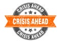 crisis ahead round stamp with ribbon. label sign Royalty Free Stock Photo