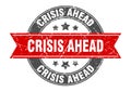 crisis ahead round stamp with ribbon. label sign Royalty Free Stock Photo