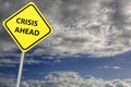 Crisis ahead sign with stormy sky as the background Royalty Free Stock Photo