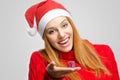 Crisis Christmas. Beautiful red hair woman holding a small Christmas present. Royalty Free Stock Photo