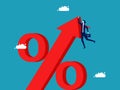 Crisis of increasing interest rates. Businessman falling from percentage symbol. Recession. Bankruptcy