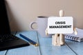 Crisis management. Text label in the planning notebook on the Manager's briefcase. Royalty Free Stock Photo
