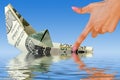 Crisis. money ship in water Royalty Free Stock Photo