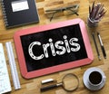 Crisis - Text on Small Chalkboard. 3D Illustration.