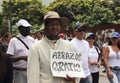 Religious activist hands out Free Hugs in Caracas Venezuela amid violent protests in Caracas against Nicolas Maduro government