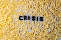 Crisis word made with letter soup pasta. Economic concept