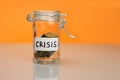 Crisis word on piggy Bank, moneybox, money jar with coins Royalty Free Stock Photo