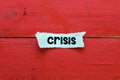 CRISIS. Word crisis written on a piece of paper. Economic crisis concept Royalty Free Stock Photo