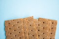 Crisp bread on the blue background. Corn dodger. Crackers. Loaf of bread Royalty Free Stock Photo