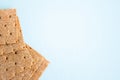 Crisp bread on the blue background. Corn dodger. Crackers. Loaf of bread Royalty Free Stock Photo