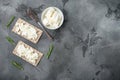 Crisp bread with cream cheese, on gray stone table background, top view flat lay, with copy space for text Royalty Free Stock Photo