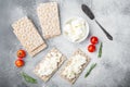 Crisp bread with cream cheese, on gray stone table background, top view flat lay Royalty Free Stock Photo