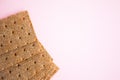 Crisp bread on the pink background. Corn dodger. Crackers. Loaf of bread Royalty Free Stock Photo