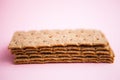 Crisp bread on the pink background. Corn dodger. Crackers. Loaf of bread Royalty Free Stock Photo