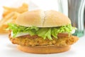 Crisp chicken burger tomato onion cheese lettuce Royalty Free Stock Photo