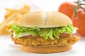 Crisp chicken burger tomato onion cheese lettuce