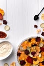 Crisp crunchy organic vegetable chips with oven-baked pumpkin, beetroot, tomato, carrot chips snacks with sauce