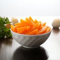 Crisp and fresh Frozen orange carrot in white bowl, healthy