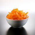 Crisp and fresh Frozen orange carrot in white bowl, healthy