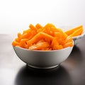 Crisp and fresh Frozen orange carrot in white bowl, healthy