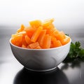 Crisp and fresh Frozen orange carrot in white bowl, healthy