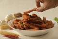 Crisp fried baby corn or Baby corn fritters prepared by deep frying steamed baby corn dipped in a spicy flour batter