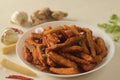 Crisp fried baby corn or Baby corn fritters prepared by deep frying steamed baby corn dipped in a spicy flour batter