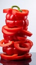 Crisp red bell pepper slices on a white background, showcasing vivid freshness